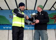 Pete Clunas lifts the Splash & Mad Dash trophy